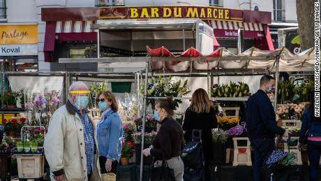 Buyers at the Place de la Bastille market in Paris, on May 17, 2020. 