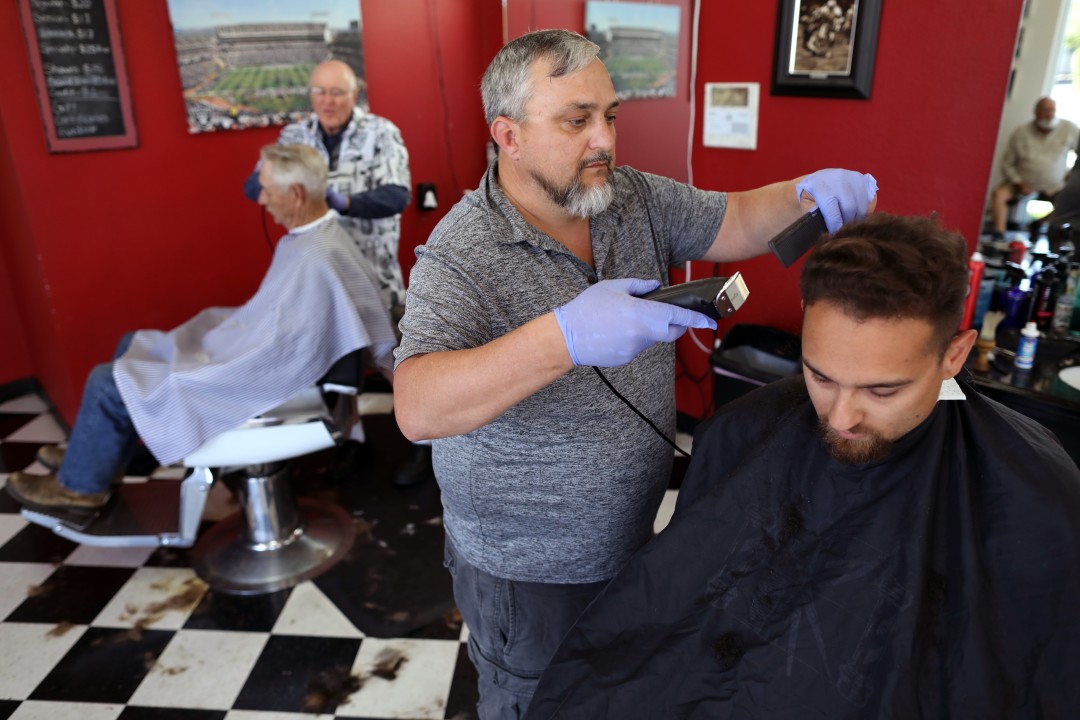 Wes Heryford cut Ben Martin's hair at the Cutte House Barber Shop in Yuba City.
