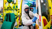 A health worker cleans and disinfects an ambulance after sending a patient to the Intensive Care Unit (ICU) at Danderyd Hospital near Stockholm on May 13.