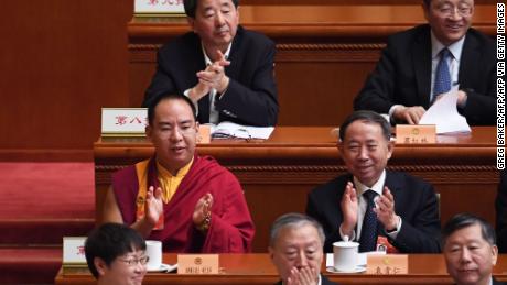 The 11th Panchen Lama Gyaincain Norbu chosen by the Chinese government welcomed the applause in the plenary session of the Chinese People's Political Consultative Conference in Beijing on March 10, 2019.
