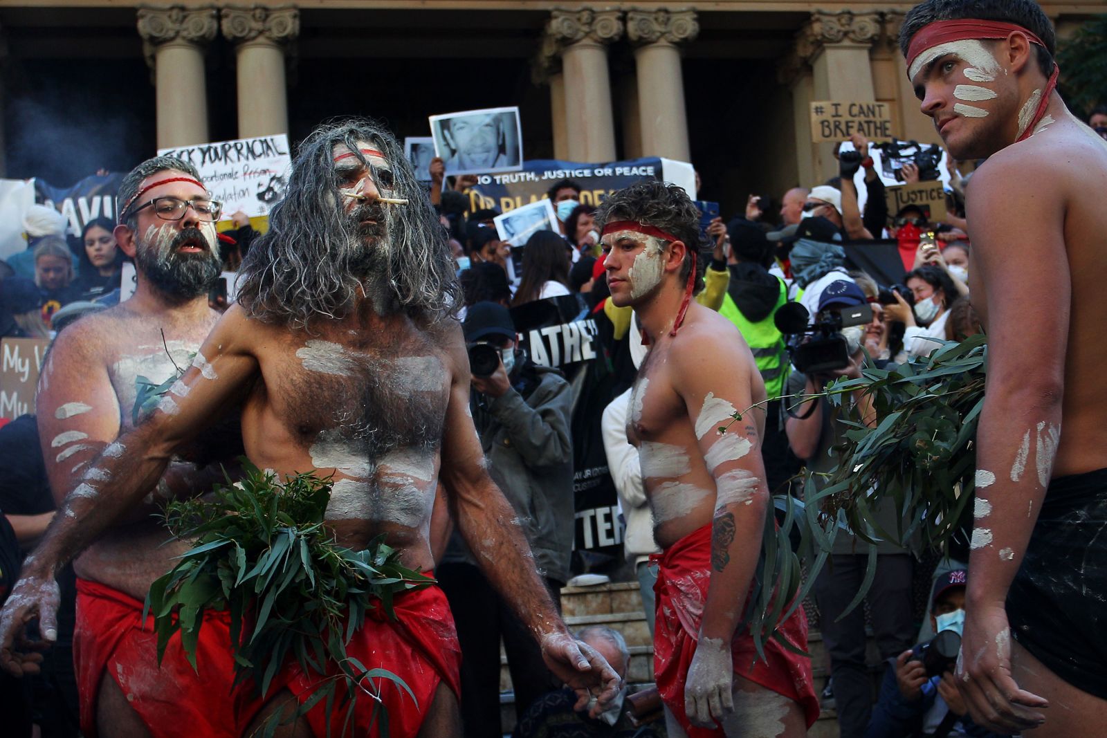 Indigenous protesters hold a traditional smoking ceremony at City Hall in Sydney, Australia, on June 6.