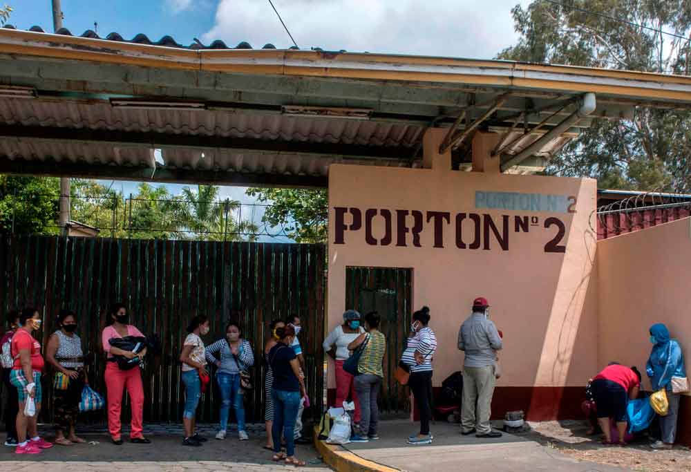 Relatives of patients of Aleman-Nicaraguense Hospital, which cares for people infected with Covid-19, wait to enter the hospital in Managua, Nicaragua, on June 1.