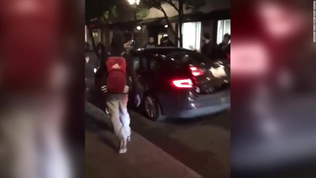 Video shows the moment a man drove his car into a group of protesters in downtown Portland, injuring three.