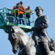 An inspection crew from the Virginia Department of General Services takes measurements of the Robert E. Lee statue in Richmond, Virginia, on June 8.