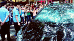 People take pictures of Japanese cars damaged during protests against Japan's nationalization & # 39; The disputed Diaoyu Islands, also known as the Senkaku Islands in Japan, in the Chinese city of Xi, on 15 September 2012. 