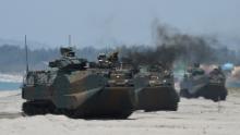 Japanese Land Self Defense Forces' amphibious assault vehicles hit the beach during amphibious landing exercises in the Philippines in 2018.