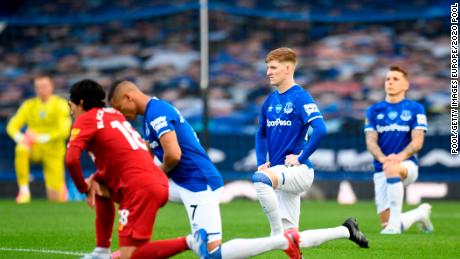 Players and officials bowed to support the Black Lives Matter movement before the Merseyside derby between Everton and Liverpool at Goodison Park. 