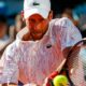 Serbia's Novak Djokovic returns the ball during an exhibition tournament in Zadar, Croatia, Sunday, June 21, 2020. Tennis player Grigor Dimitrov says he has tested positive for COVID-19 and his announcement led to the cancellation of an exhibition event in Croatia where Novak Djokovic was scheduled to play on Sunday. (AP Photo/Zvonko Kucelin)