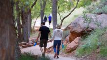 Pedestrians walk along footpaths in Zion National Park, Utah, which has been closed due to a pandemic.