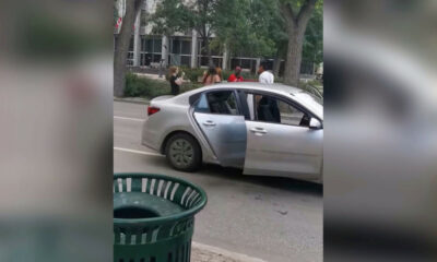 Woman attacks Black Lives Matter demonstrators with hockey sticks in Canada