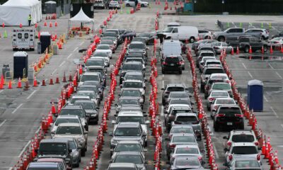 Cars line up as drivers wait to be tested for Covid-19 at the Hard Rock Stadium parking lot in Miami Gardens, Florida, on July 6.