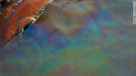 A layer of gasoline is seen on the surface of the Daldykan River.
