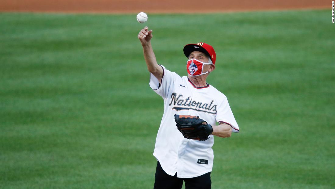 Dr. Fauci takes a break from fighting the pandemic to throw the first pitch of the MLB season