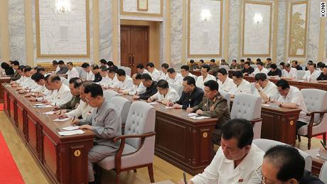 North Korean leader Kim Jong Un was seen at a meeting Thursday in this photo provided by KCNA. Officials don't seem to wear masks or practice social distance.
