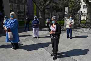 Health workers in Buenos Aires pay homage to a colleague who died from the virus.