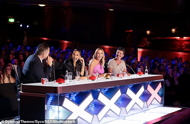Team: Simon is pictured with talent judges David Walliams, Amanda Holden and Alesha Dixon during an episode of the show which aired in May