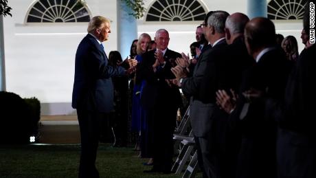 President Donald Trump arrives to listen to first lady Melania Trump speak at the 2020 Republican National Convention from the Rose Garden of the White House, Tuesday, Aug. 25, 2020, in Washington. 