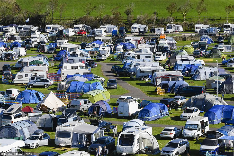Hundreds of caravan-owners camping at Freshwater Beach Holiday Park in Burton Bradstock, Dorset. The Met Office said it would be sunny but that temperatures would plummet
