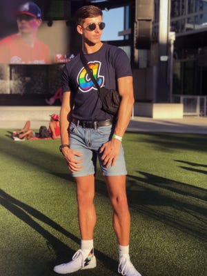 Garrett Weed, a senior at Georgia State University, attends an Atlanta Braves game in the summer of 2019 celebrating LGBT pride.