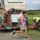 A family takes belongings from their home as the evacuate ahead of Hurricane Laura making landfall