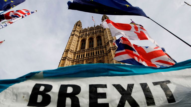 TOPSHOT - Brexit banner visible outside Parliament in London October 30, 2019 - UK political leaders checked their campaigns today after parliament backed Prime Minister Boris Johnson's bid for a preliminary - Christmas poll to break the long-standing deadlock Brexit.  (Photo by Tolga AKMEN / AFP) (Photo by TOLGA AKMEN / AFP via Getty Images)