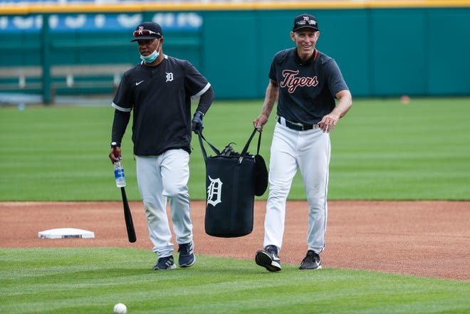 Detroit Tigers third base coaches Ramon Santiago and Alan Trammell drag a sack of ball towards a hill during a training camp at Comerica Park in Detroit, Tuesday July 7, 2020.