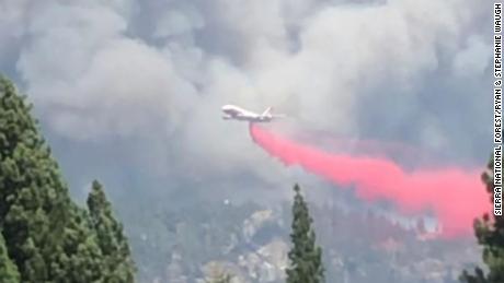 An aerial tanker drops a fire retardant on a wildfire in the Sierra National Forest.