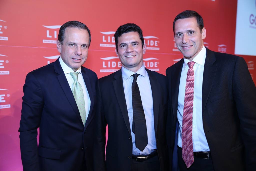 At the 2015 Lide event, Moro poses with toucans Doria and Fernando Capes, both involved in the Sao Paulo lunch scandal.