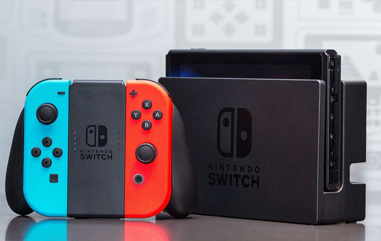 Imagem: Foto do Nintendo Switch e o controle padrão do console.